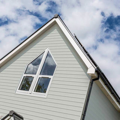 House gable finished beautifully with Coastline Composite Shiplap Cladding Board 5m Long Coastline Composite Shiplap Cladding Boards - Anthracite Grey