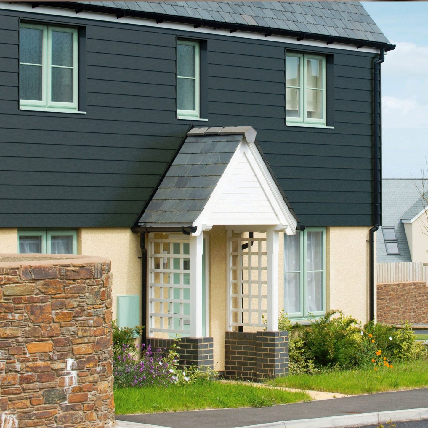 Coastline cladding works beautifully with rendered wall 5m Long Coastline Composite Shiplap Cladding Boards - Anthracite Grey