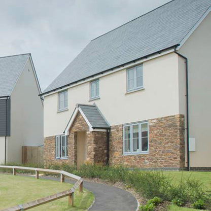 House clad in Oyster White Coastline Cladding Board 5m Long Coastline Composite Shiplap Cladding Boards - Anthracite Grey